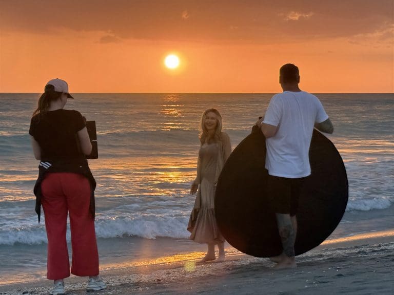 Filming on the beach during sunset